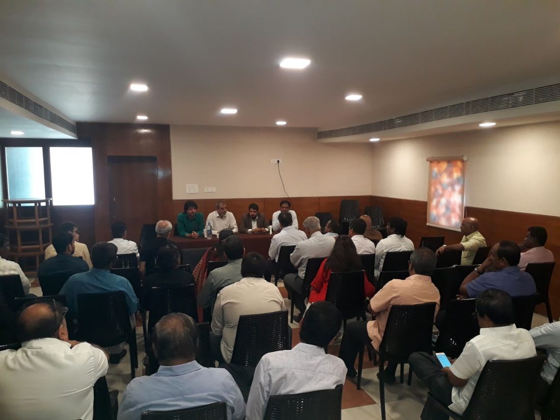 Members seated at a CREAA general meeting