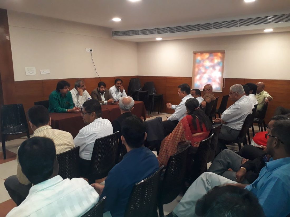 Members in discussion at a CREAA meeting